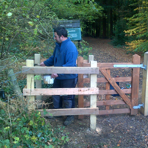 Pete Faithfull staining a gate